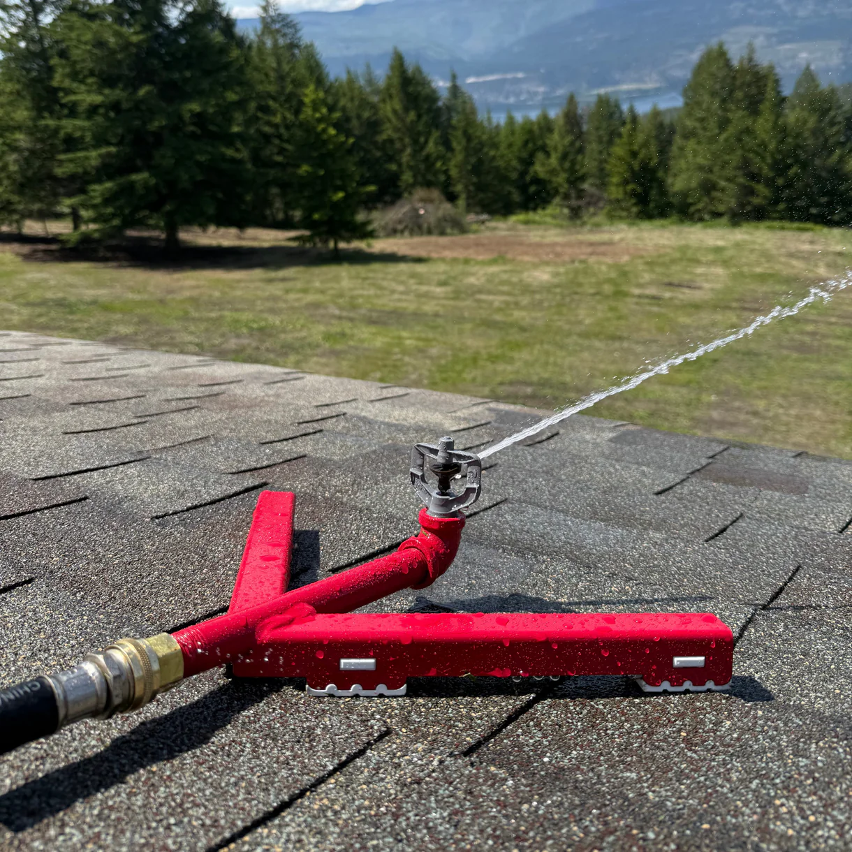 Y-mount rooftop sprinkler spraying across property
