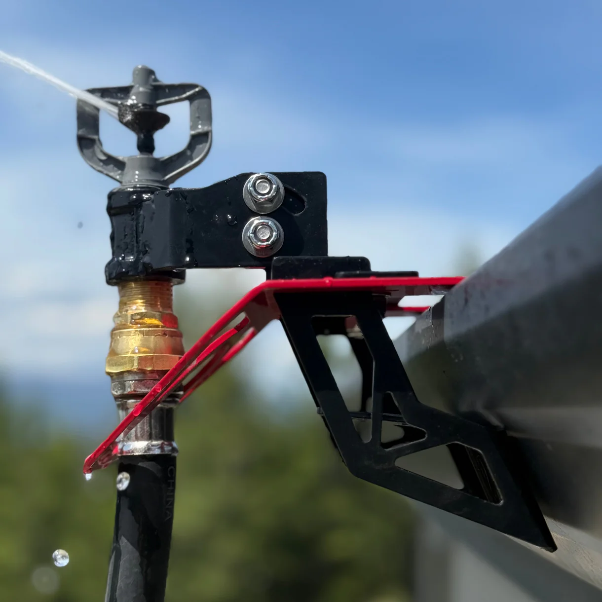 Rooftop wildfire sprinkler head spraying a fine mist